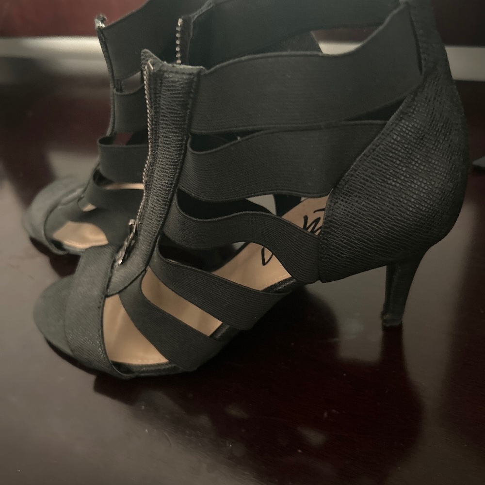 Black zippered up sandals